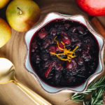 Cranberry sauce served in a white ceramic bowl.