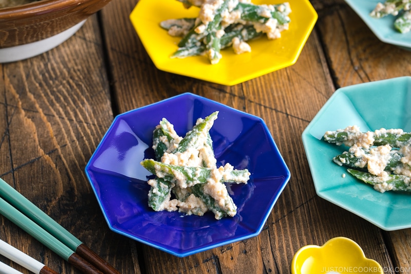 Green bean shiraae in colorful Japanese ceramic plates.