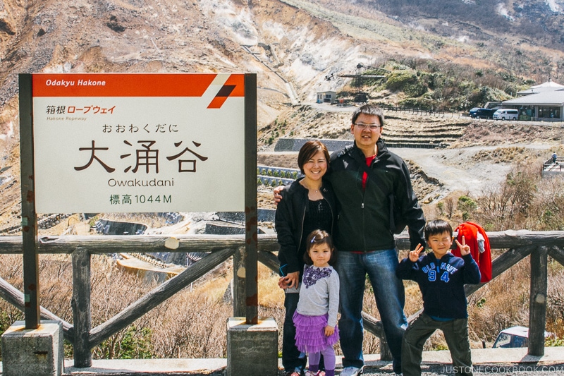 family next to Owakudani sign - Hakone Ropeway and Owakudani Hell Valley | www.justonecookbook.com