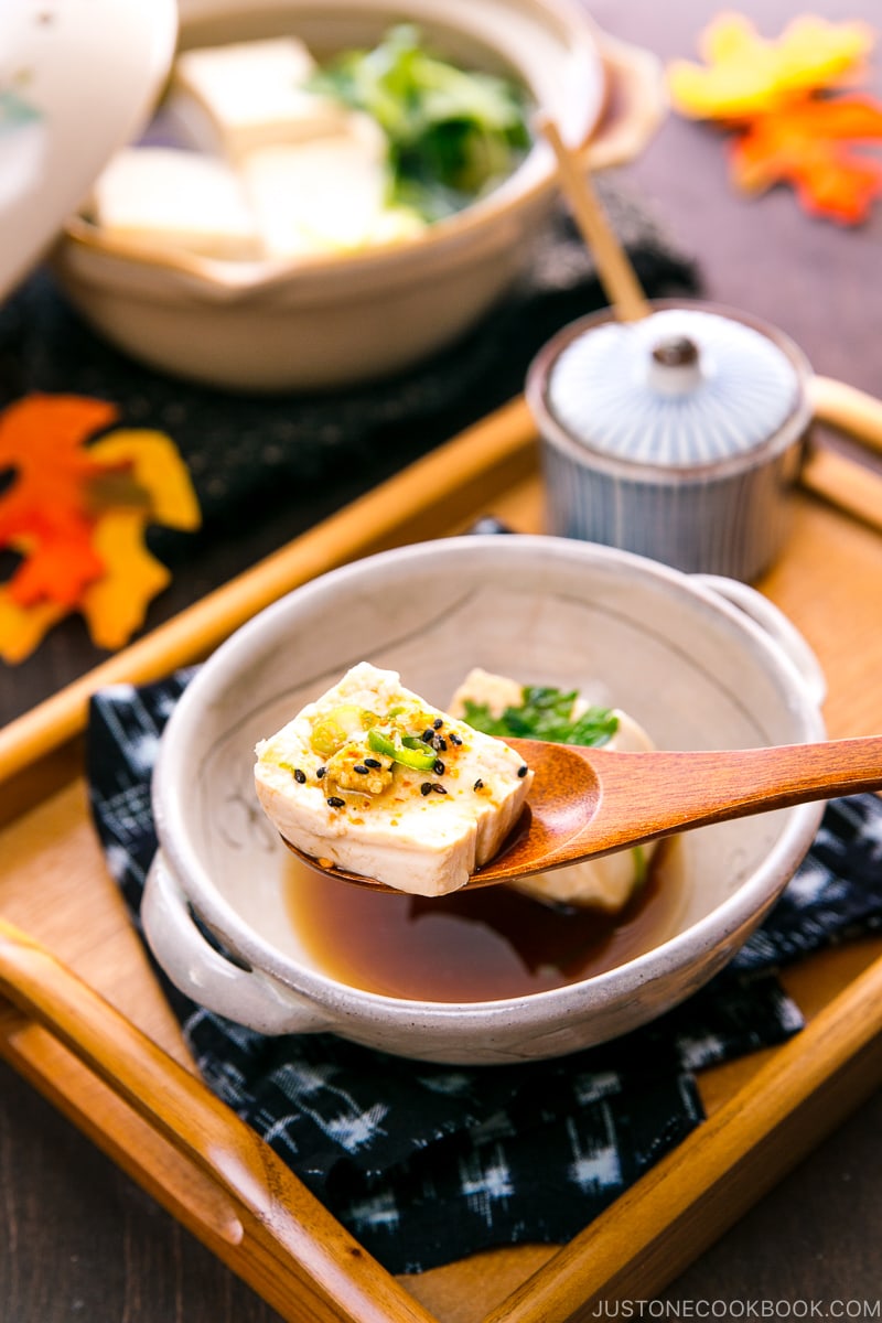 A Japanese ceramic bowl containing hot tofu.