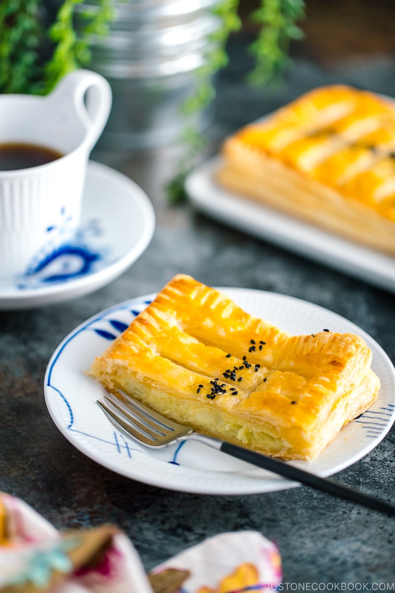 Japanese sweet potato pie served on plates along with coffee.