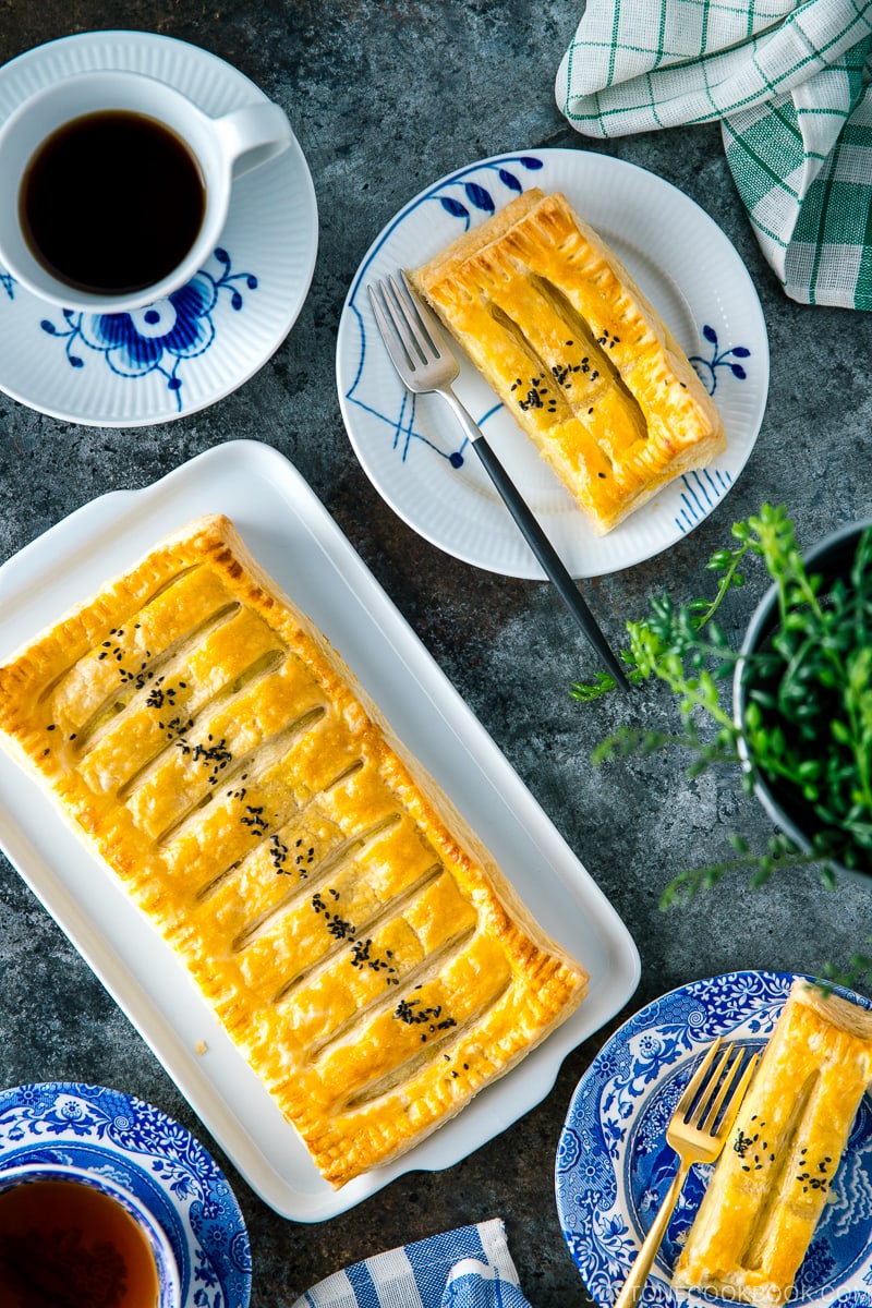 Japanese sweet potato pie served on plates along with coffee.