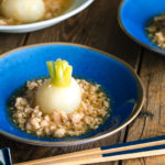 A beautiful Japanese bowl containing simmered Japanese turnips sitting on the thick minced chicken sauce.