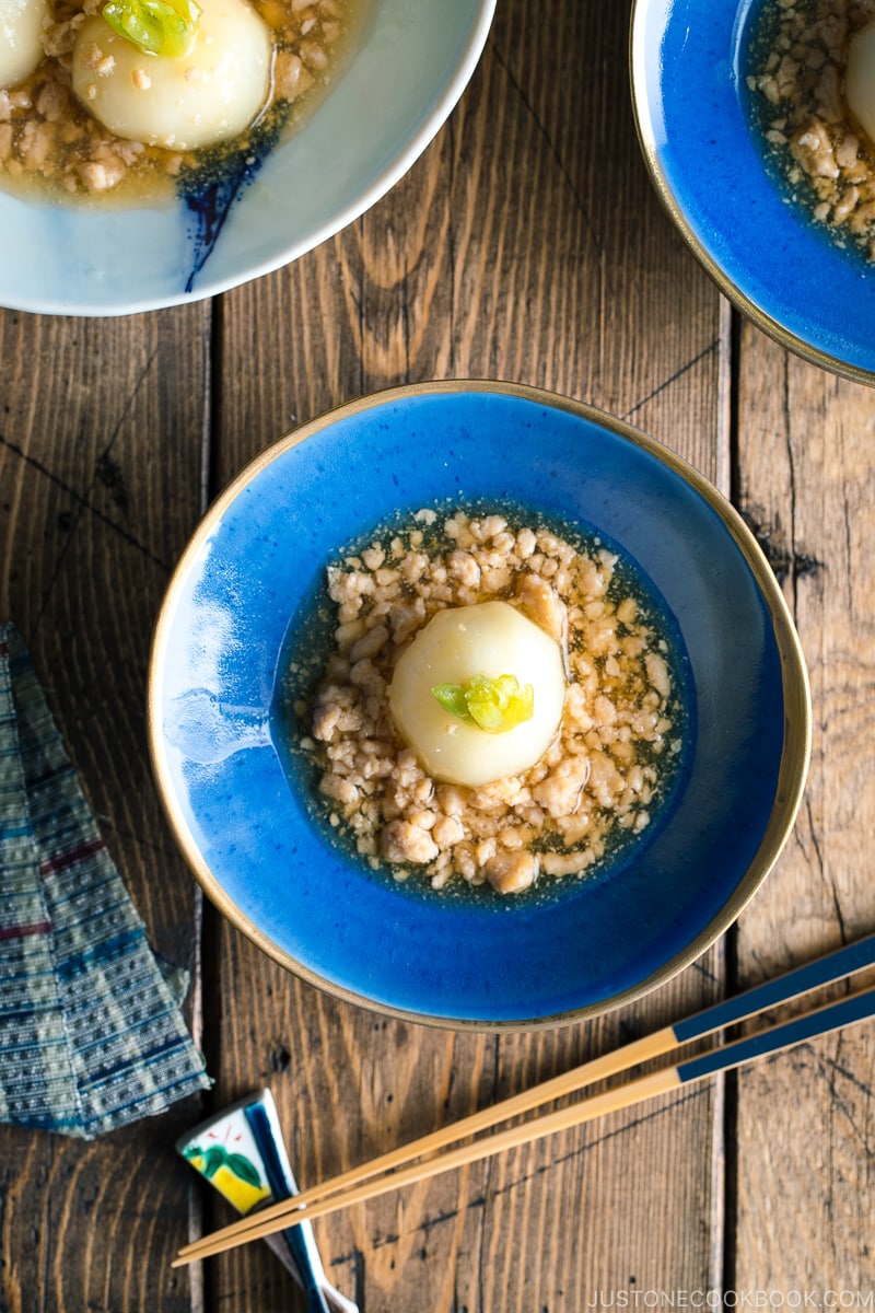 A beautiful Japanese bowl containing simmered Japanese turnips sitting on the thick minced chicken sauce.