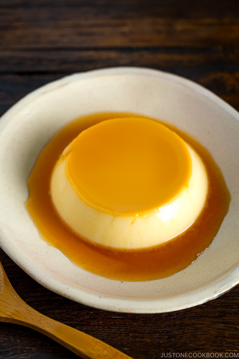 Creme caramel (flan) on a white plate.