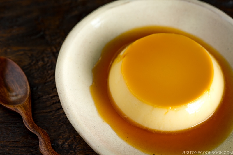 Creme caramel (flan) on a white plate.