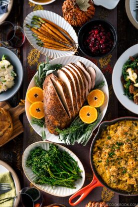 A table filled with Thanksgiving & holiday dishes.