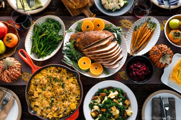 A table filled with Thanksgiving & holiday dishes.