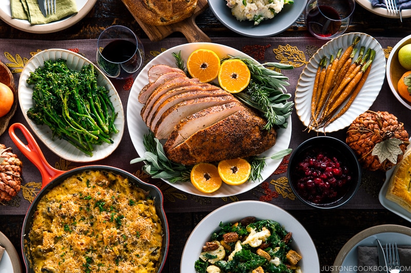 A table filled with Thanksgiving & holiday dishes.