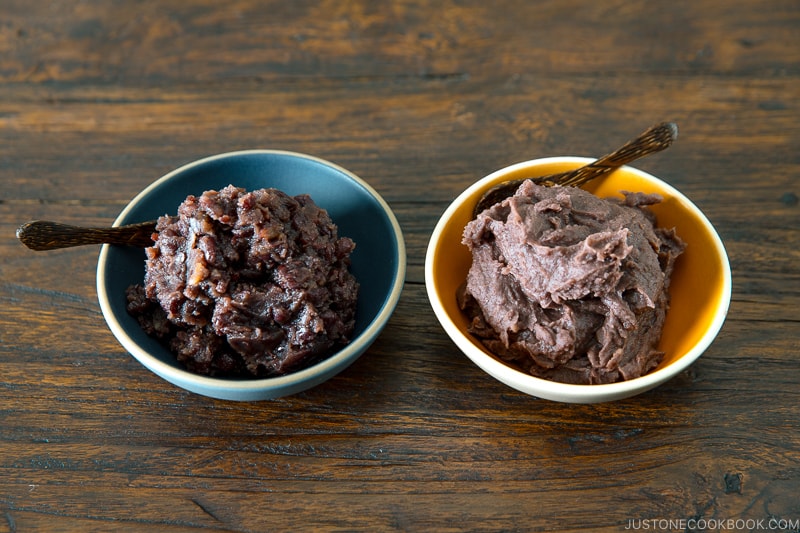 Two bowls containing fine and chunky sweet red bean paste (anko).