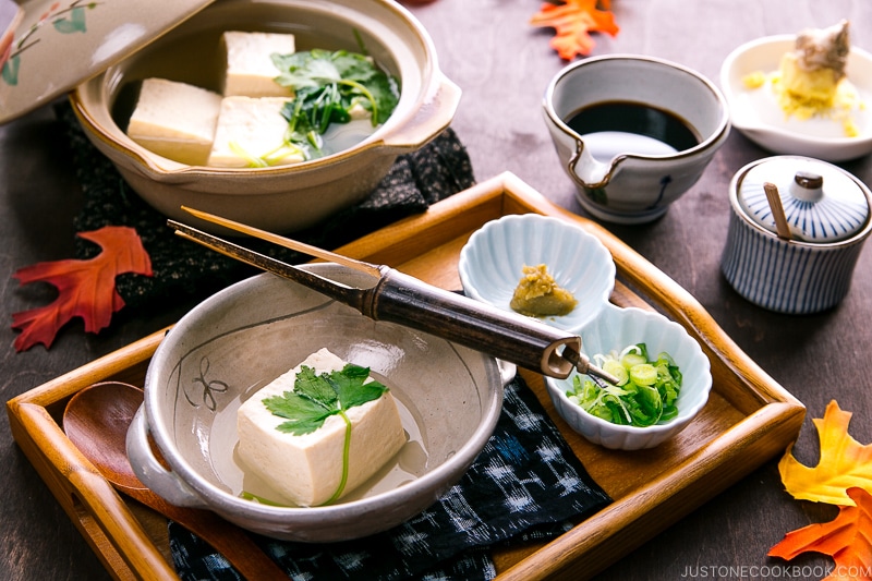 A Japanese ceramic bowl containing hot tofu.