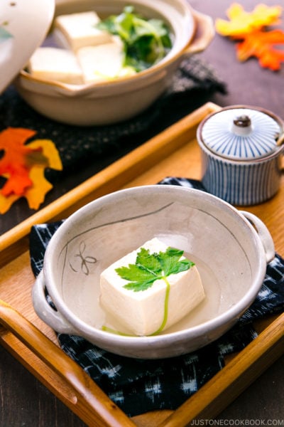 A Japanese ceramic bowl containing hot tofu.