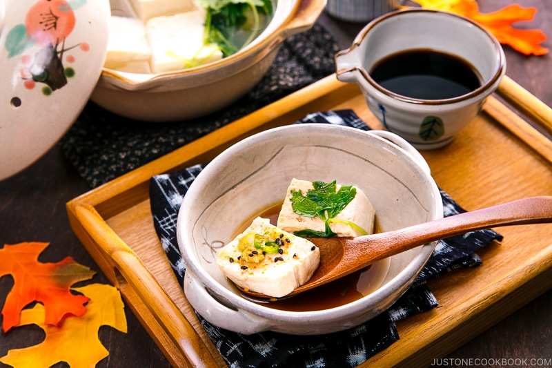 A Japanese ceramic bowl containing hot tofu.