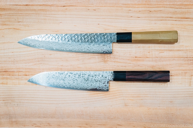 picture of Japanese knives on wooden cutting board