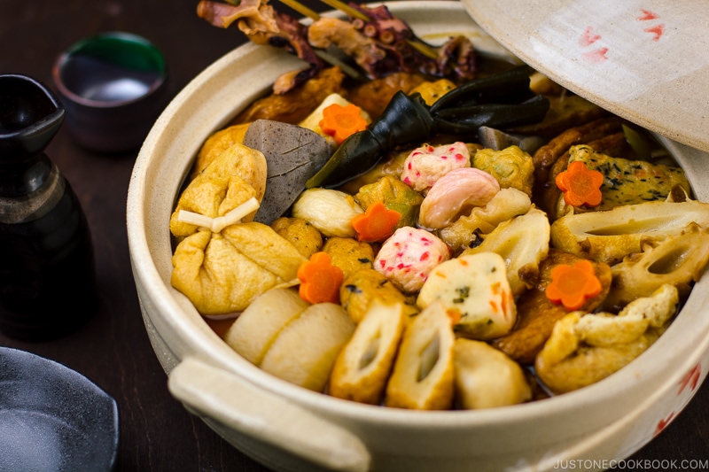 A donabe containing fish cakes and fish balls simmered in soy sauce-based dashi broth.