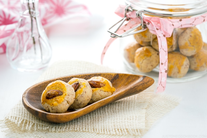 Chinese almond cookies and a glass jar of the cookies.