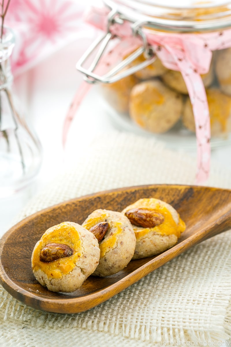 Chinese almond cookies and a glass jar of the cookies.