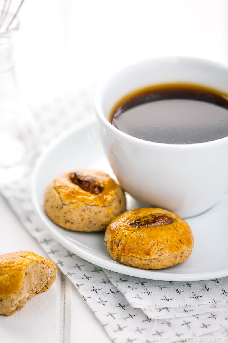 Chinese almond cookies served with a cup of coffee.