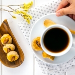 Chinese almond cookies served with a cup of coffee.