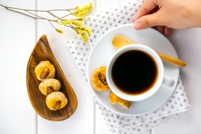 Chinese almond cookies served with a cup of coffee.