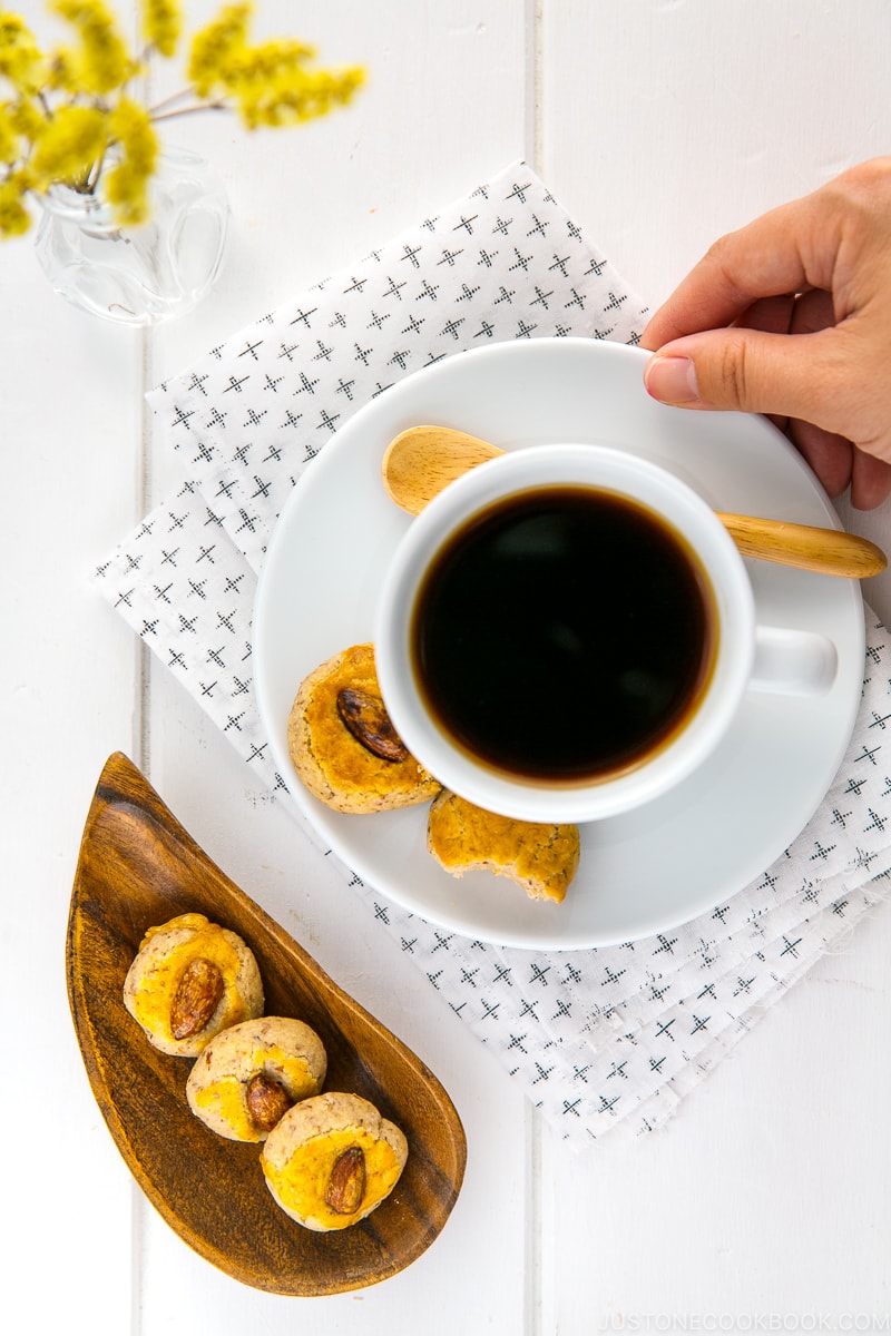 Chinese almond cookies served with a cup of coffee.