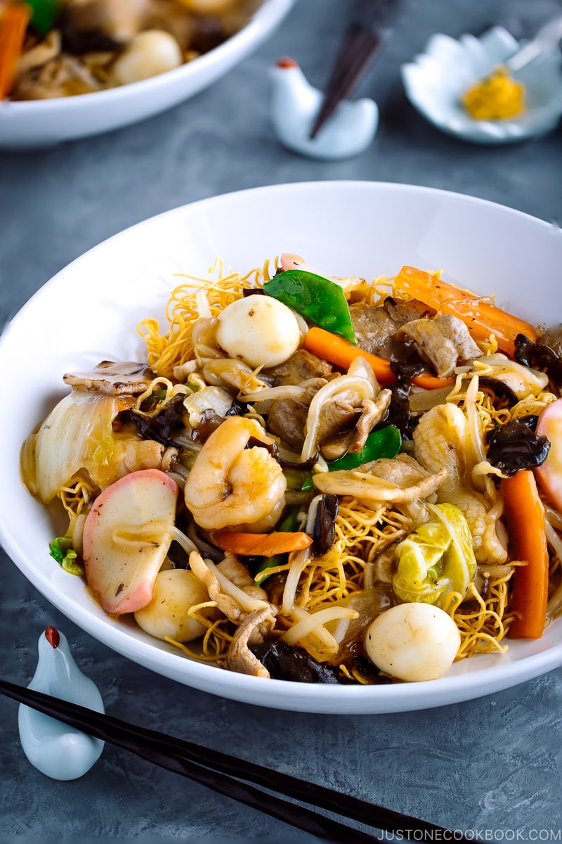 A white bowl containing Crispy Noodles with Seafood (Sara Udon).