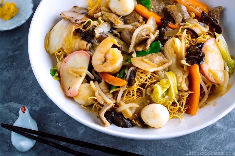 A white bowl containing Crispy Noodles with Seafood (Sara Udon).