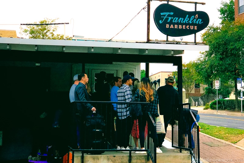 customer waiting outside the door at Franklin Barbecue in Austin TX