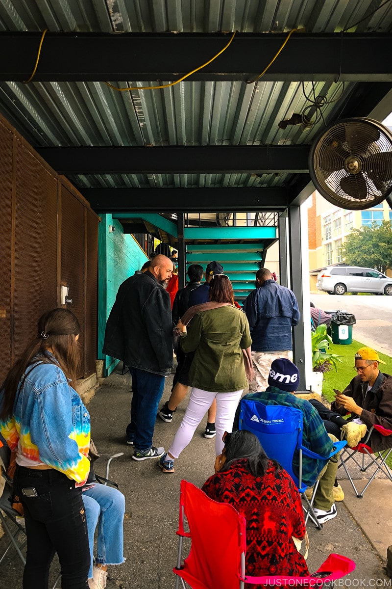 customers waiting outside Franklin Barbecue in Austin TX