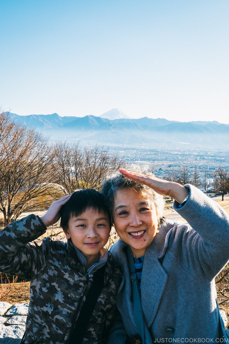 boy and lady posing in front of Mt. Fuji - Yamanashi Fruit Picking and Wine Tasting | www.justonecookbook.com