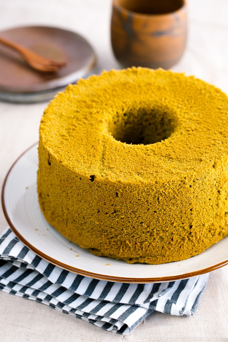 Green tea chiffon cake served on a white plate.