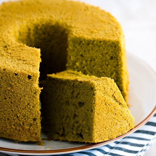 Green tea chiffon cake served on a white plate.