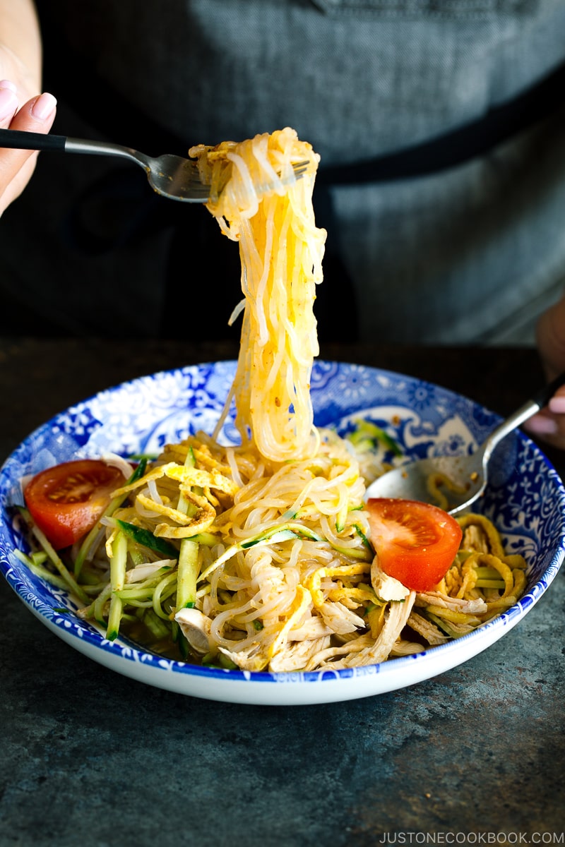 A blue bowl containing cold and refreshing shirataki noodles with honey sesame dressing.