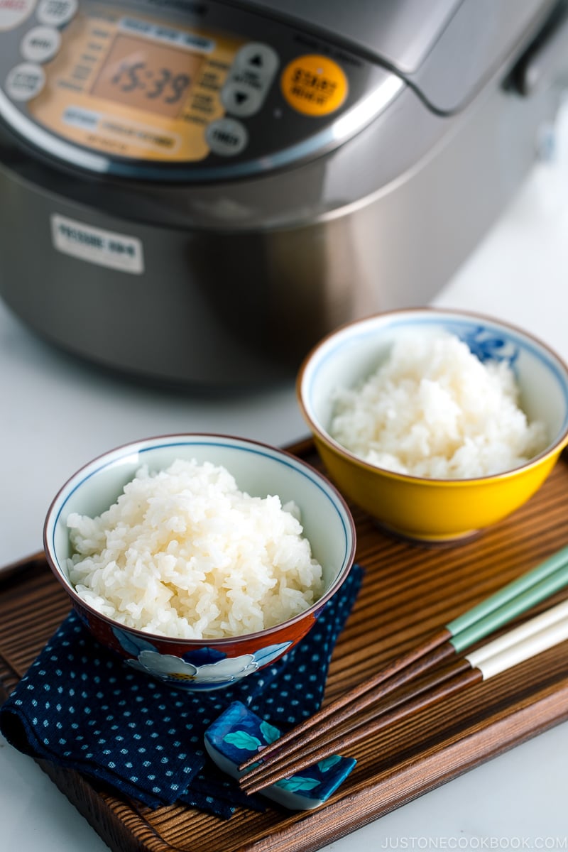 Japanese rice bowls containing perfectly cooked Japanese rice.