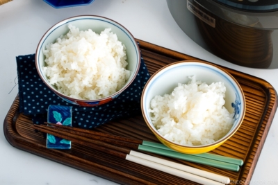 Japanese rice bowls containing perfectly cooked Japanese rice.