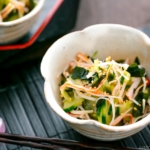 A flower shape bowl containing Japanese Cucumber Salad with Crab.