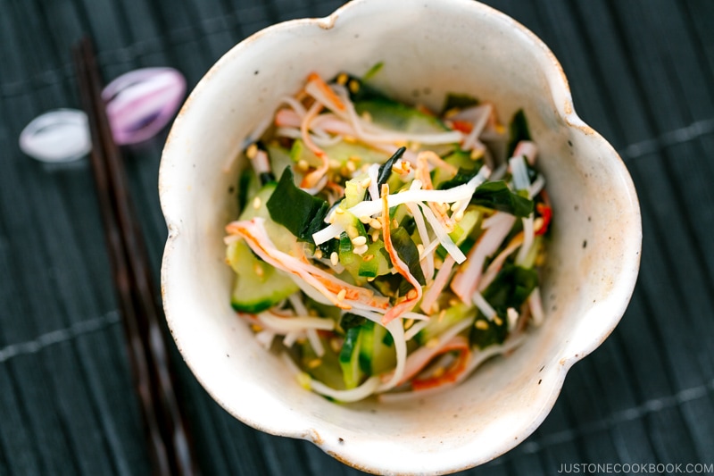 A flower shape bowl containing Japanese Cucumber Salad with Crab.