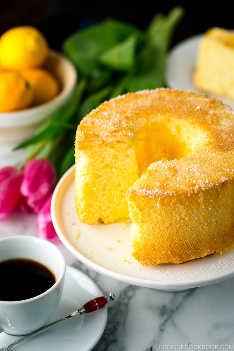 Meyer Lemon Chiffon Cake on a white cake stand.