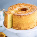 Orange chiffon cake served on a cake stand.