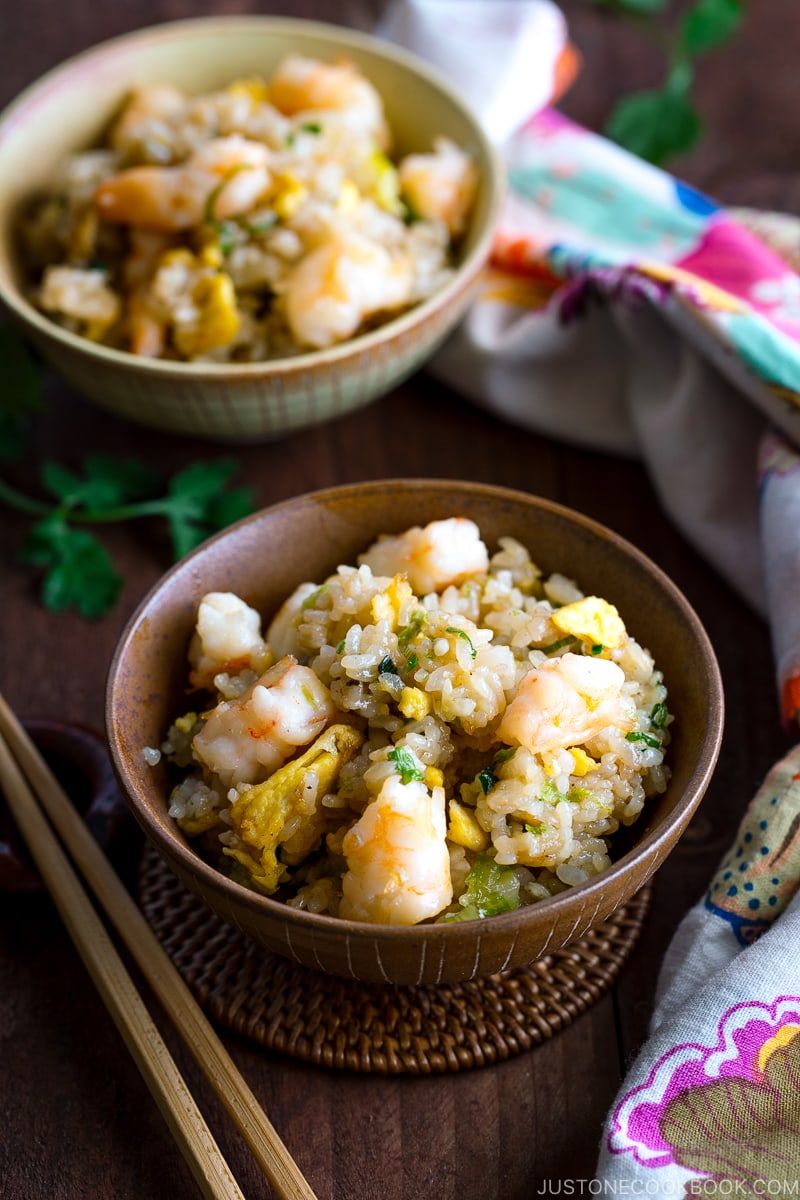 Rice bowls containing shrimp fried rice.