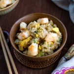 Rice bowls containing shrimp fried rice.