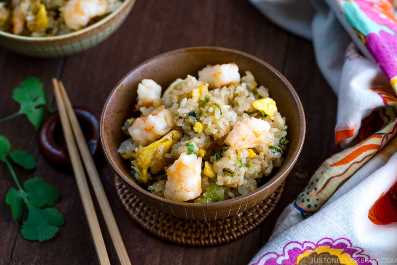 Rice bowls containing shrimp fried rice.