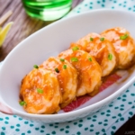 A white plate containing Spicy Shrimp Stir Fry (Ebi Chili).