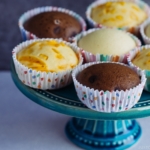 3 types of steamed cakes on a cake stand.