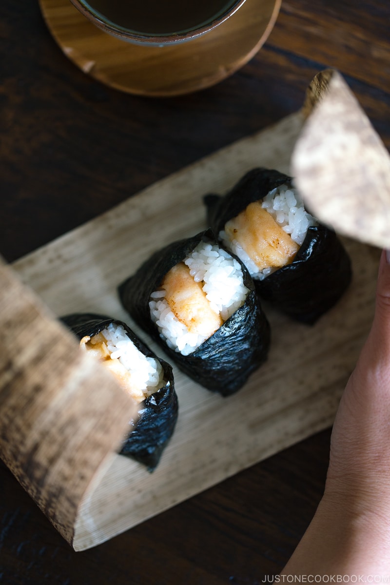 Tenmusu (Shrimp Tempura Rice Balls) on a bamboo wrap.