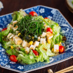 Refreshing Tofu Salad with Sesame Ponzu Dressing on a Japanese blue platter.