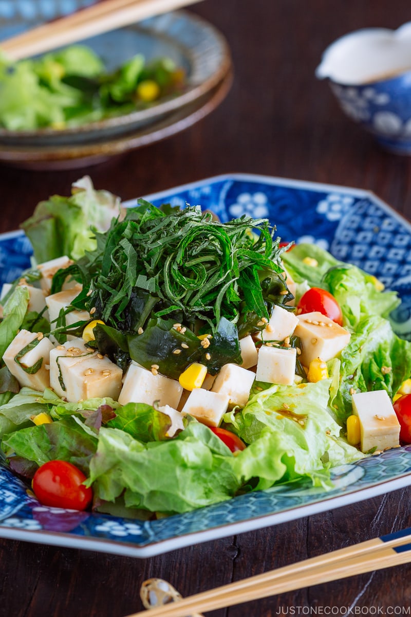 Refreshing Tofu Salad with Sesame Ponzu Dressing on a Japanese blue platter.