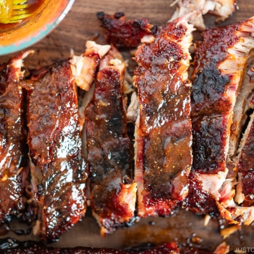 Smoked baby back ribs with bbq sauce.