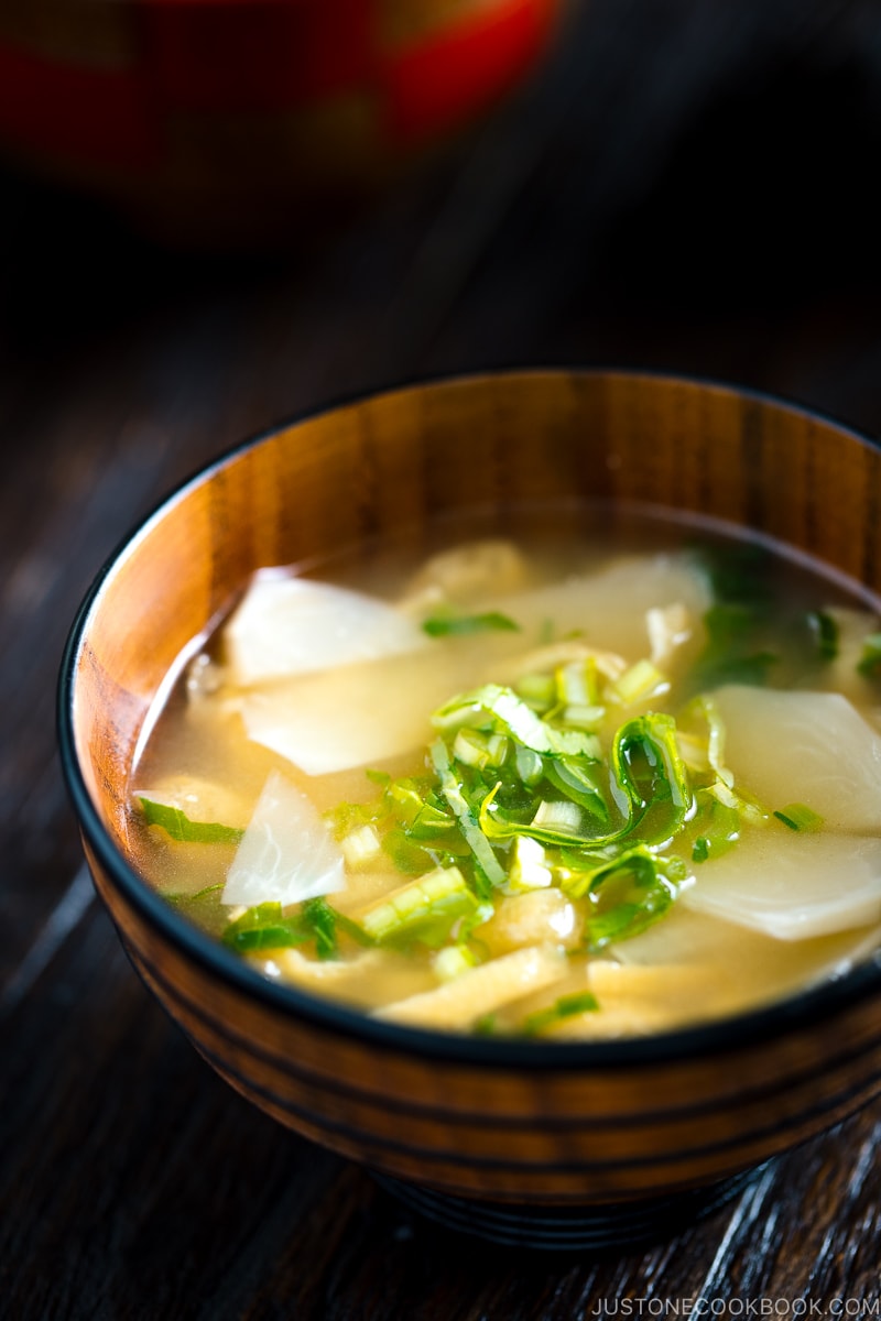 Three kinds of vegetable miso soups; each served in a Japanese wooden bowl.