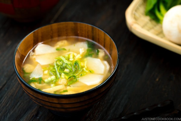 Three kinds of vegetable miso soups; each served in a Japanese wooden bowl.